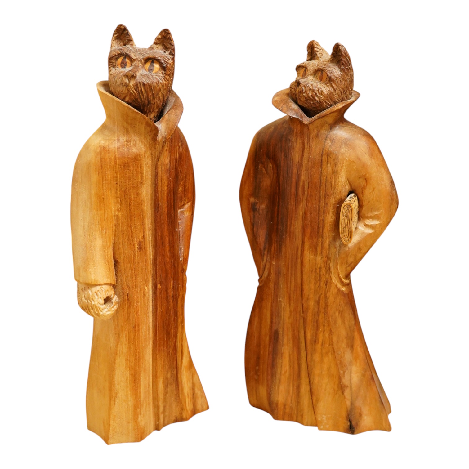 Pierre Decorse (b.1953), a pair of carved hardwood cats and a novelty lamp modelled as a stack of books, with shade, largest overall 36cm high